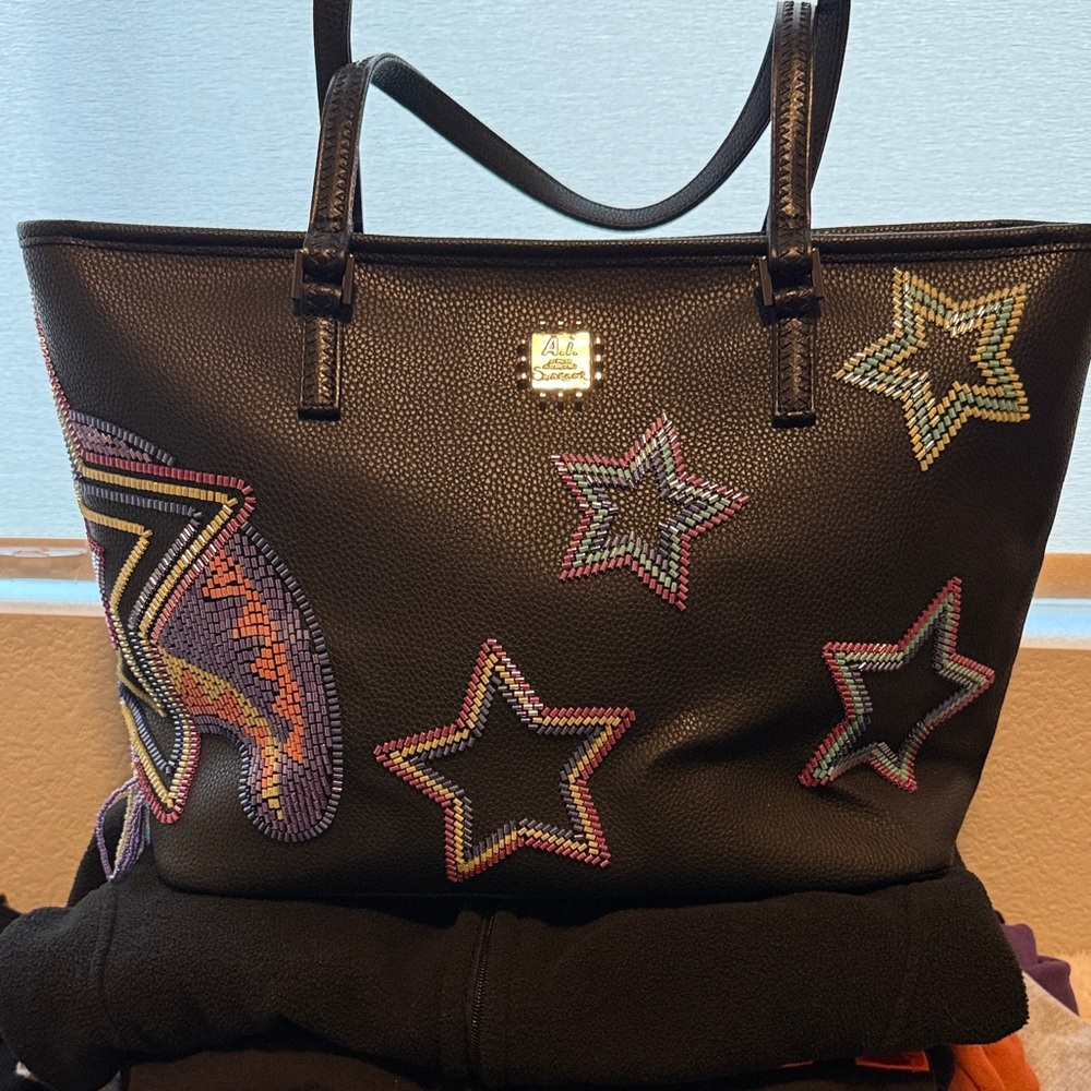 Sprayground Black Tote with Colorful Star Patterns